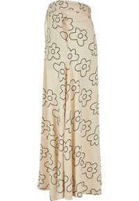 Fusta bej cu model floral negru, realizată dintr-un material moale, dotată cu un brâu elastic și un design fluid cu o potrivire lejeră.