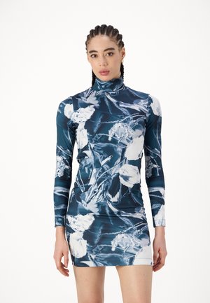 Long-sleeved dress featuring a blue and white floral abstract pattern, made of stretchy material, with a high neckline and figure-hugging silhouette.