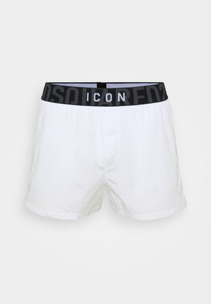 Boxer shorts bianchi con una vita elasticizzata nera e marchiata con la dicitura "ICON." Realizzati in materiale leggero, presentano una vestibilità standard e sono privi di fantasie.