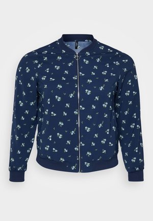 Jūrinis bombonešis su gėlių raštu, mažomis mėlynomis gėlėmis ir žaliomis lapėmis, užtrauktuko uždarymu ir raukiniais ant rankovių bei apykaklės.