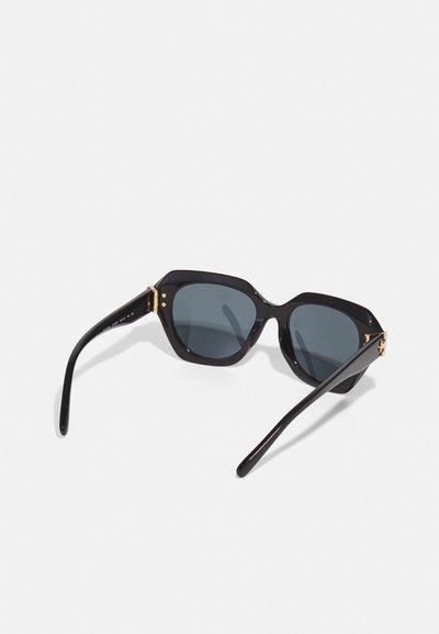 Black octagonal sunglasses made of plastic with dark gray lenses. Features gold accents on the temples and smooth, glossy texture.