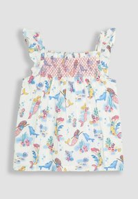Top floral de verano con tirantes con volantes, cuerpo fruncido y un colorido patrón submarino que presenta sirenas, delfines y corales sobre tela blanca.
