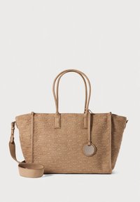 Beige, textured tote bag with embossed pattern, dual top handles, detachable shoulder strap, and round charm. Features structured shape and zip closure.