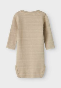 Beige knitted dress with long sleeves, featuring textured stripes and rounded neckline. Side snaps for easy dressing. Soft material.