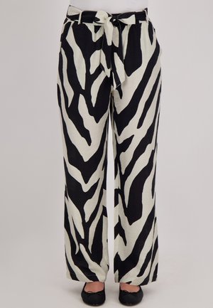 Wijde broek in een zebra print ontwerp met zwart en ivoor kleuren. Bevat een gestrikt tailleband en een lichte, gestructureerde stof.