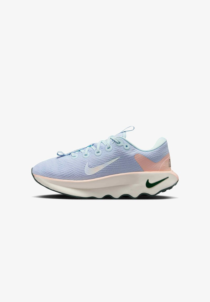 Light blue athletic shoes with a textured upper, pink accents, and a green logo. Features a thick white midsole and a contrasting dark outsole.