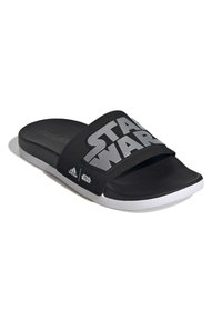 Svarta flip-flops med en bred rem som har silverfärgad "STAR WARS" text. Tillverkade av syntetmaterial, med en vit sula och texturerad innersula.