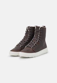 Brown leather high-top sneakers with a textured surface, white rubber sole, and contrasting gray laces. Features a soft lining at the collar.