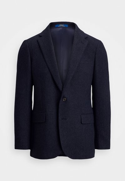 Mörkblå herringbone kavaj i ull med slag, enkelknappsstängning, fickor med klaffar och mörk inredning.