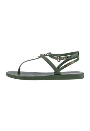 Sandalo verde piatto con sottili cinturini, anello per l'alluce, fibbia regolabile alla caviglia e suola testurizzata, marchiato con "Ipanema" sulla cinghia laterale.