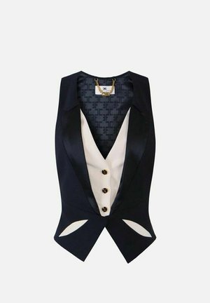 Gilet su misura nero senza maniche con scollo a V profondo, pannello interno bianco, tre bottoni e dettaglio a catena dorata sul colletto.