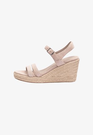 Sandale compensée beige avec plateforme en corde tressée, deux brides avant et bride de cheville ajustable avec boucle en métal.