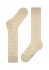 Beige Knöchelsocken mit einer weichen, strukturierten Oberfläche. Sie verfügen über eine verstärkte Ferse und Zehen, ein nahtloses Design und einen leichten Rippbund am Öffnung.