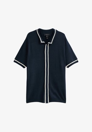Gebreide poloshirt in donkerblauw met witte afwerking, korte mouwen, knoopsluiting en een ontspannen pasvorm. Gestructureerde stof met een gladde afwerking.