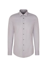 Lichtgrijze longsleeve met een kraag, knoopsluiting aan de voorkant en een subtiele textuur. Beschikt over zwarte knopen en een gebogen zoom.