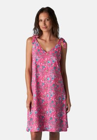 Abito floreale rosa con scollo a V e spalline con nodo. Tessuto leggero con un motivo vivace di fiori blu e gialli.