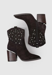 Alma en Pena Botines de tacón - brown