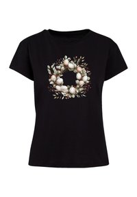 Black cotton t-shirt featuring a wreath design with eggs, leaves, and berries in pastel colors on the front. Short-sleeved, round neckline.