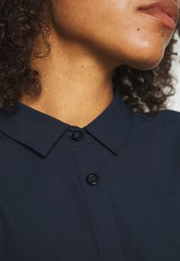 Houdini ROUTE SHIRT DRESS - Sports dress - blue illusion