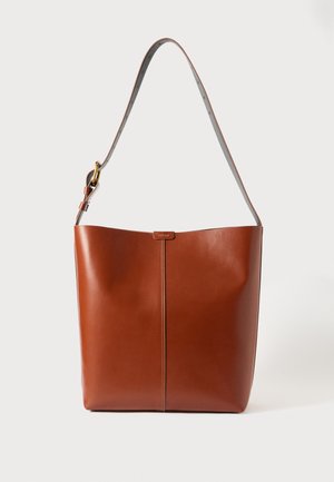 Brown leather tote bag with a smooth finish, wide open top, and a single shoulder strap featuring a gold hardware accent.