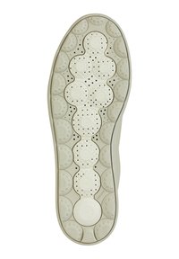 Sula av beige gummimaterial med cirkulära mönster och ventilationshål, designad för grepp och andningsförmåga.