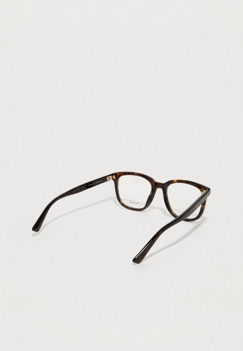 Lunettes en écaille de tortue avec une monture rectangulaire, fabriquées en plastique. Elles présentent des branches fines avec un logo discret à l'intérieur. Verres transparents.