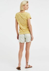 Protest PRTELLES 23 - T-shirts print - tumericyellow