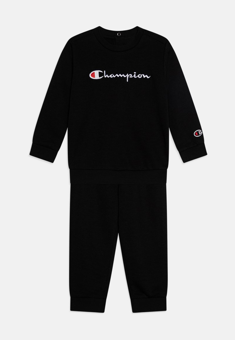 Black cotton tracksuit featuring a round neck, long sleeves, and elastic cuffs; "Champion" logo in white across the chest and sleeve.