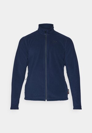 Navy blue fleece jacket with a high collar, full zipper, and side pockets. Features a smooth texture and minimal branding on the chest.