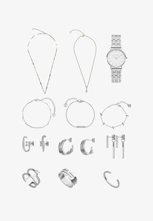 Silver jewelry collection featuring necklaces, a watch, bracelets, earrings, and rings with various textures and shapes.