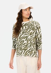 Grøn og hvid dyreprint langærmet sweatshirt med rund hals og raglanærmer. Stoffet ser blødt ud med en lidt afslappet pasform.
