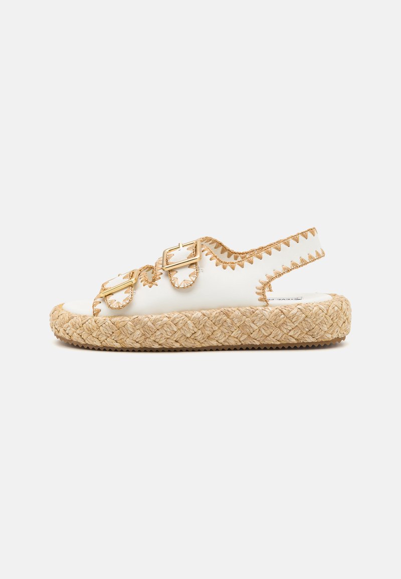 White espadrille sandal with a braided jute sole, featuring two adjustable gold buckles and embroidered accents along the edges.