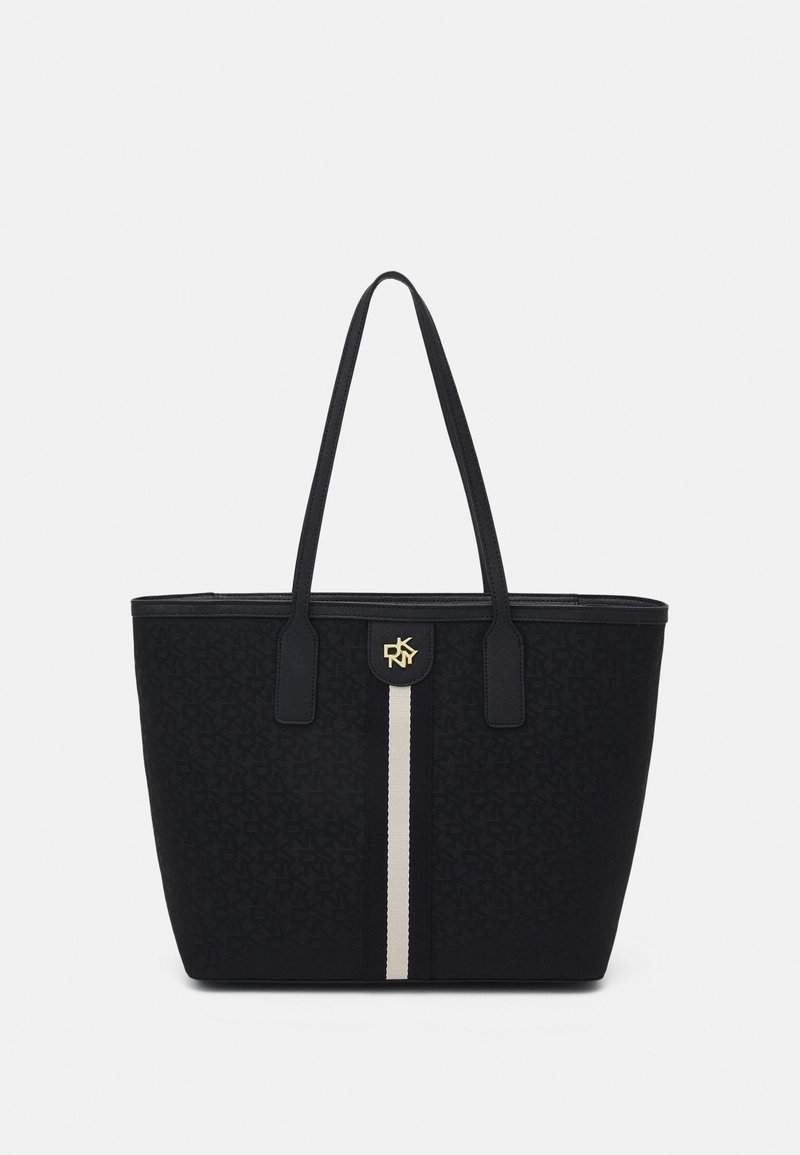 Sac tote noir avec deux longues anses, texture subtilement imprimée, une bande verticale centrale beige et un petit logo doré DKNY près du haut.