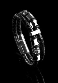 Black braided leather bracelet featuring metallic accents, including a polished silver clasp and decorative silver hardware details.