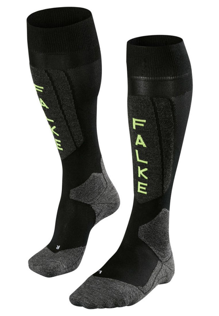 Calze nere fino al ginocchio con pannelli testurizzati e logo "FALKE" verde lime. Tallone e punta rinforzati con dettagli grigio scuro.