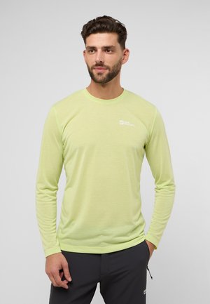 Langarmshirt van neon groene stof met een gladde textuur. Beschikt over een ronde halslijn en een klein wit logo op de bovenste linkerkant.