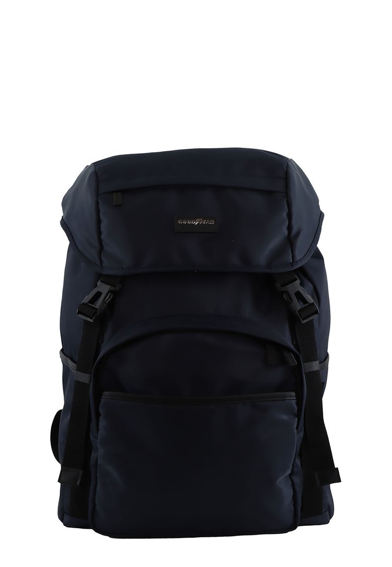 Navy blue backpack with a fold-over flap, front pocket, adjustable shoulder straps, and a smooth, durable fabric texture.