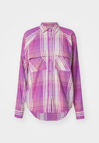 Long-sleeve plaid shirt featuring shades of pink and purple, button-down front, two chest pockets, and a rounded hem. Soft fabric texture.