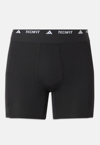 Shorts de compression athlétiques noirs pour hommes avec ceinture élastique de marque Techfit et détails de couture visibles.