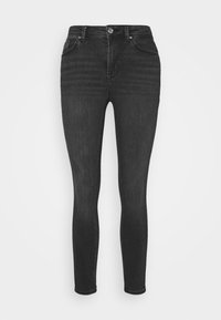 Jeans negros ajustados de denim, con cintura alta, cinco bolsillos y cierre de botón, con un ligero desgaste en los muslos.