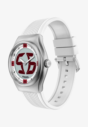 Silver analog wristwatch with white silicone strap, red accents on dial, and stylized "56" design in the center, branded Fossil.