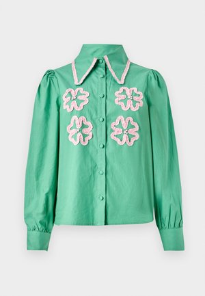 Mint green shirt with a structured collar, featuring pink floral embroidery on the front and button-down closure. Long puffed sleeves.