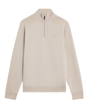 Beżowy, długi rękaw, pulower z półzamkiem przy kołnierzu i miękką fakturą. Na piersi znajduje się małe haftowane logo.