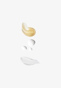Creams and lotions in shades of yellow and white; the textures range from smooth swirls to small, round drops.