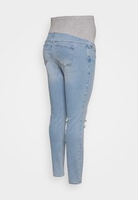 Calças de ganga azuis com uma cinturilha elástica cinza claro. Apresentam um corte slim e um ligeiro desgaste na parte inferior da perna, com bolsos traseiros limpos.