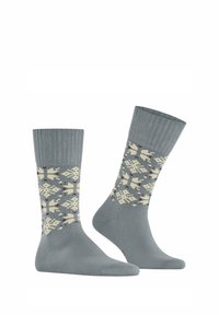 Graue Socken mit einem gerippten Bündchen, die ein aufwendiges geometrisches Muster in Creme und Kastanienbraun aufweisen. Hergestellt aus einem weichen, dehnbaren Material.