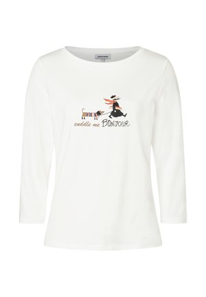 T-shirt blanc à manches longues en coton, avec un imprimé graphique représentant un chien et une figure tenant du pain, le texte dit "cuddle me BONJOUR."