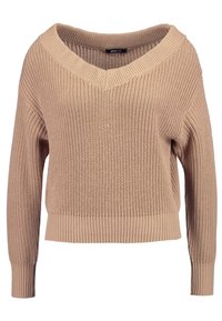 Beige oversized knit sweater, featuring a V-neck, ribbed hems, and textured pattern throughout. Long sleeves with a relaxed fit.