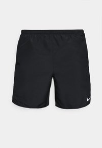 Mustat urheiluhousut, jotka on valmistettu kevyestä materiaalista. Housuissa on joustava vyötärö ja pieni valkoinen Nike-logo vasemmassa alareunassa.