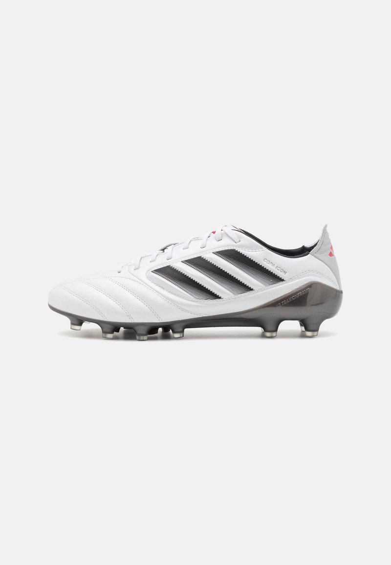 White soccer cleat with black accents and three black stripes. Features a textured upper, lace-up design, and a gray sole with studs.